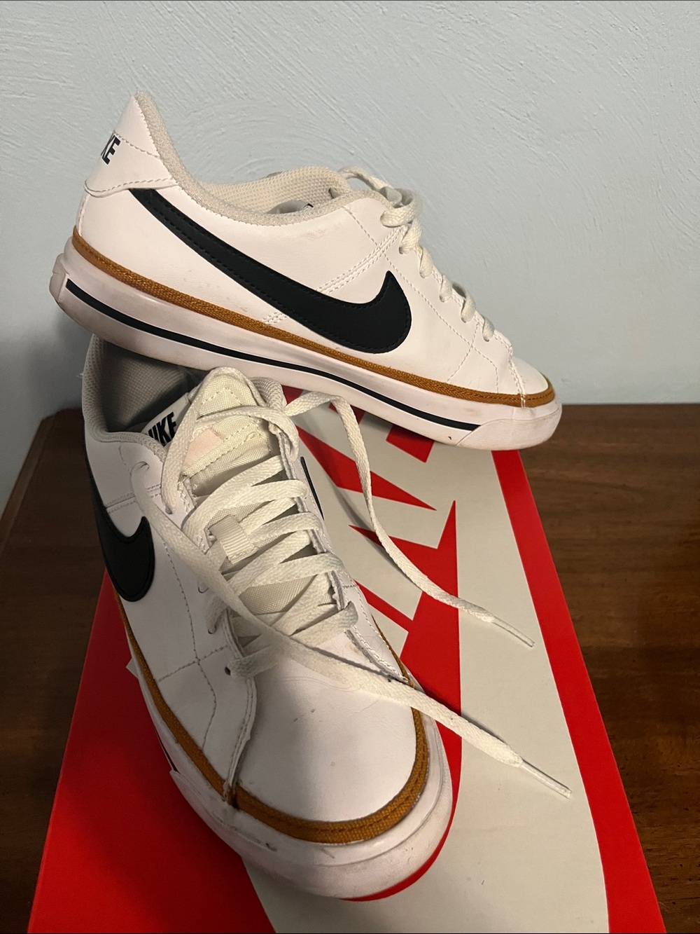Nike White Kids Sneakers with Black Swoosh and Brown Trim